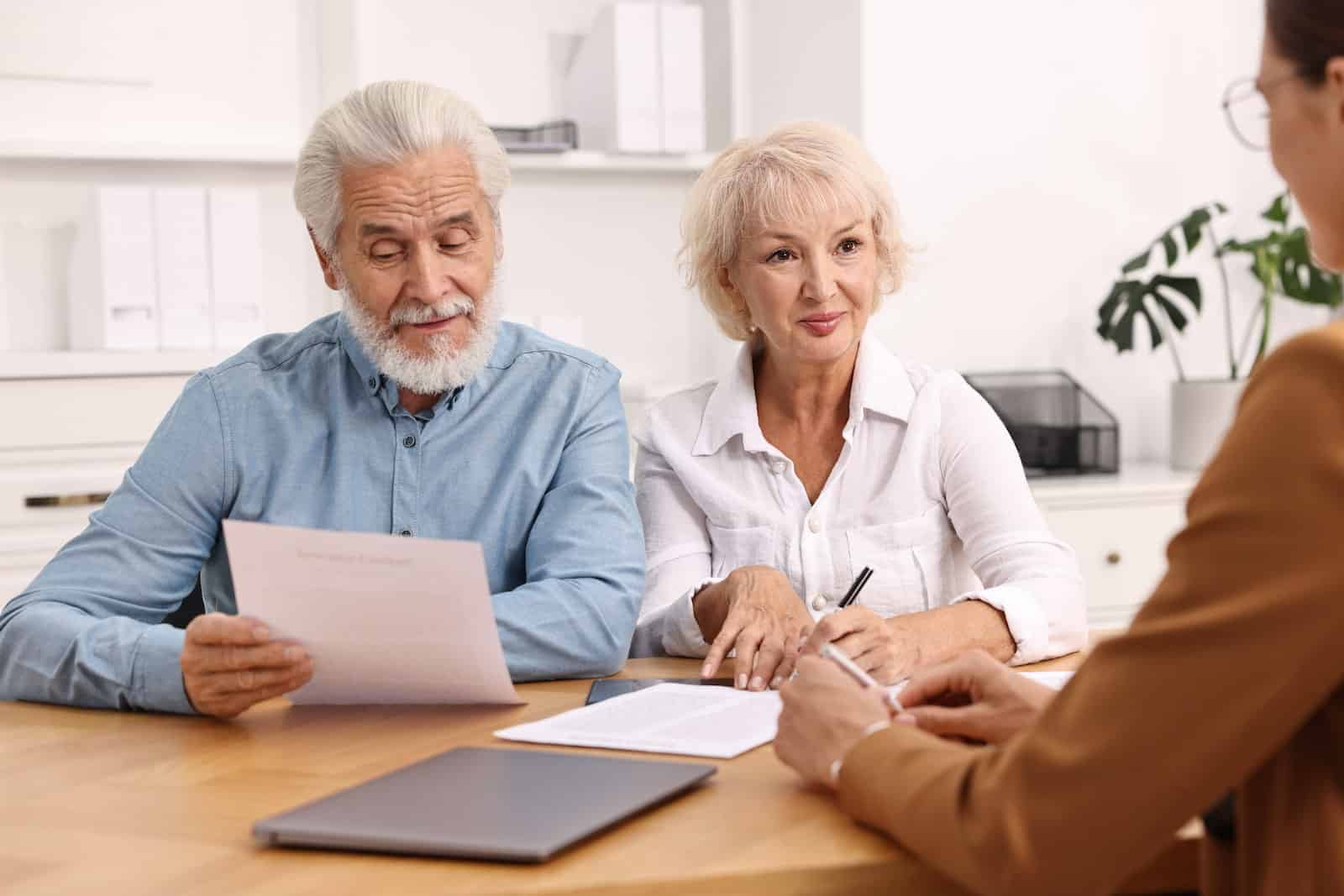 husband and wife meet with special needs trust lawyer to avoid costly mistakes