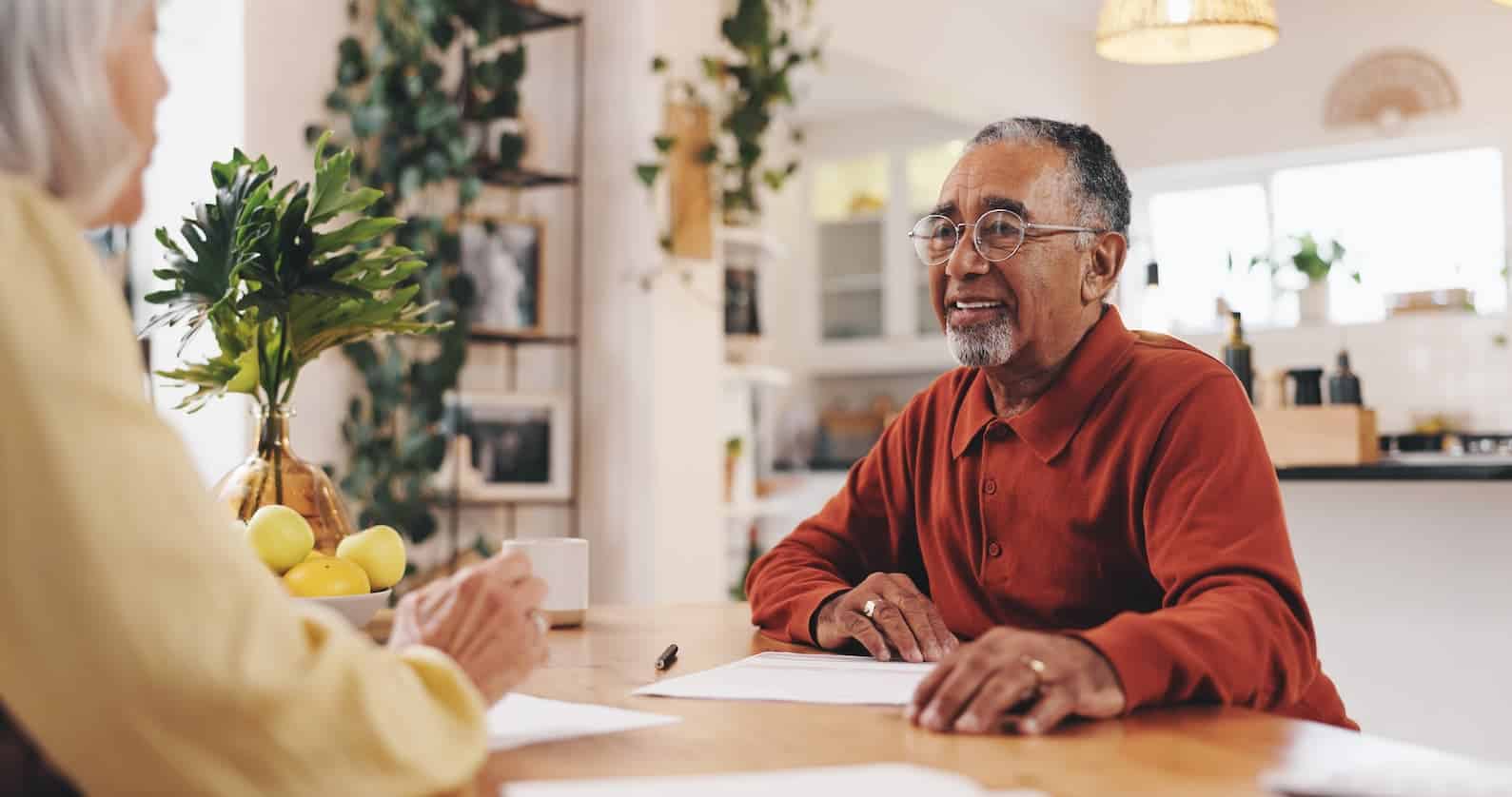 elderly man sits and discusses the Top 7 Situations Where Court Approval of a Trustee’s Actions Might Be Required